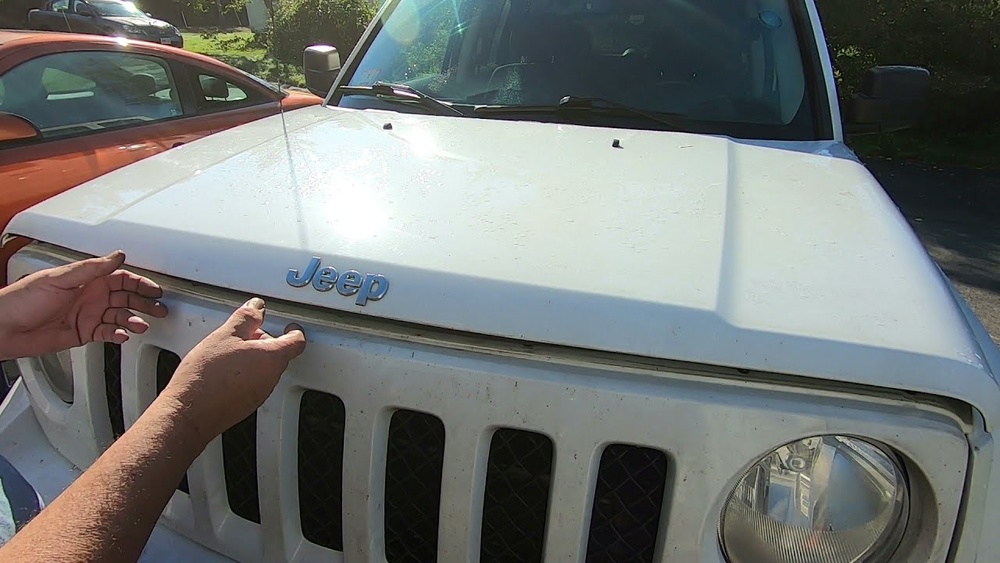how to open the hood on a jeep patriot