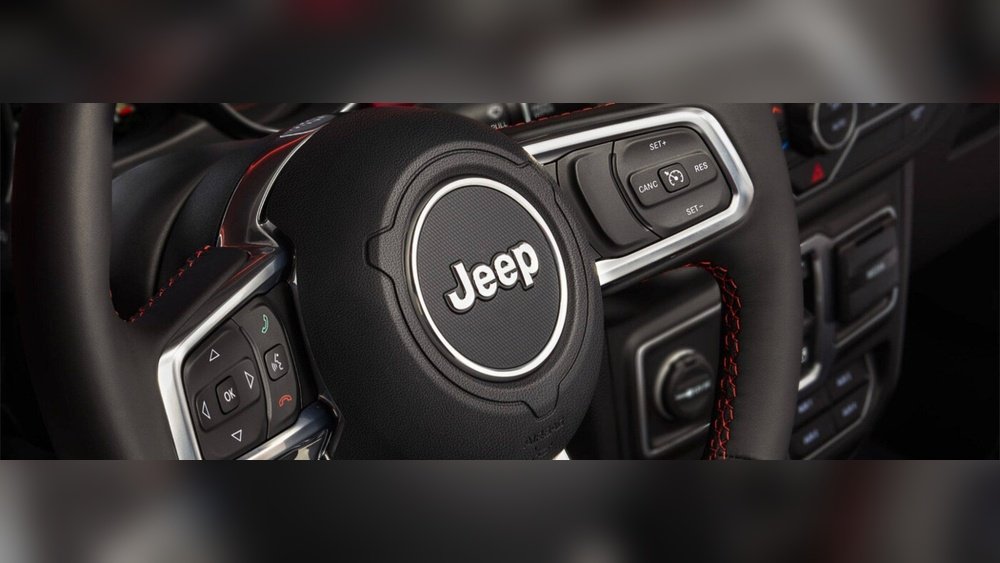 how to unlock jeep grand cherokee steering wheel