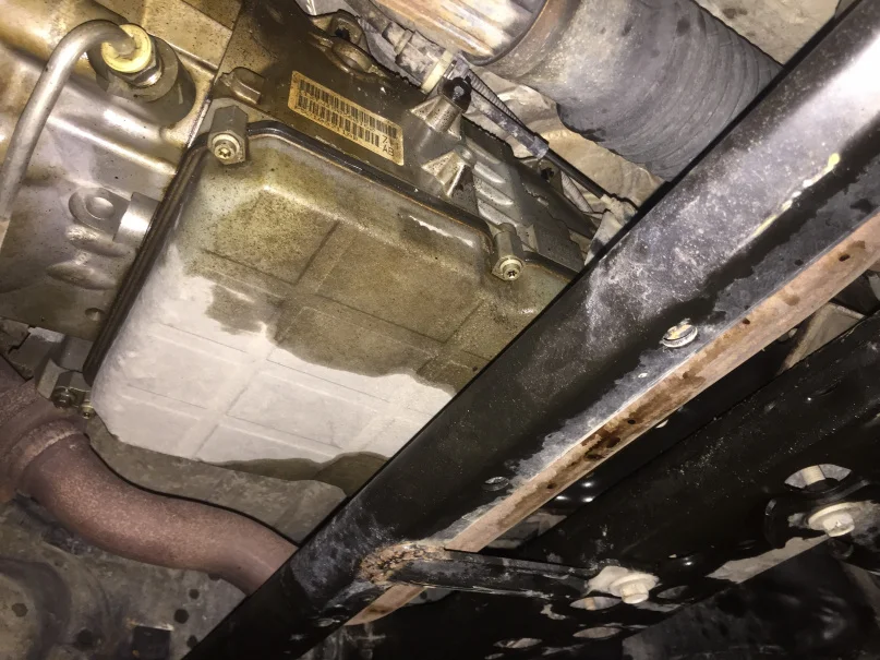 Transmission fluid leak under vehicle.