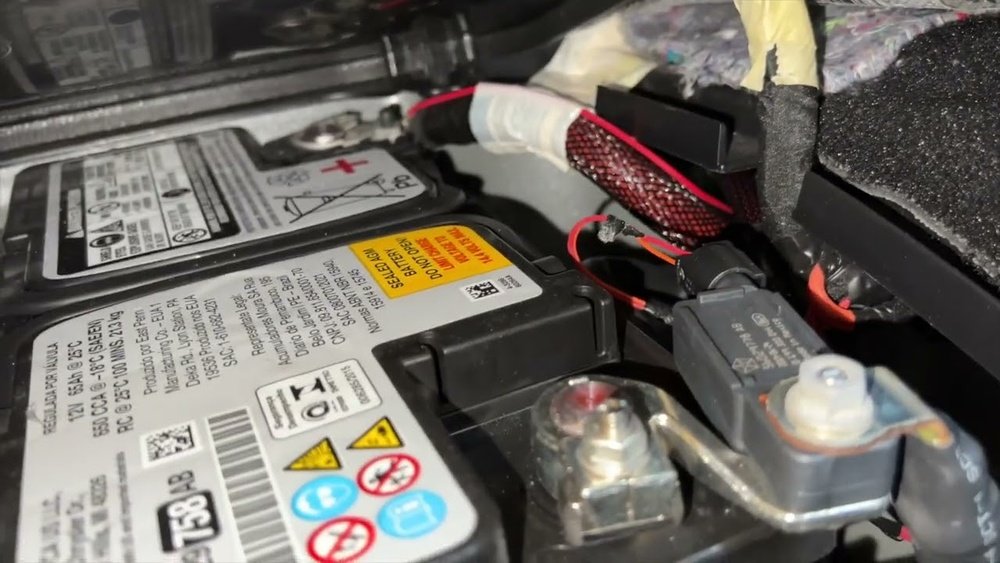 where is the battery in a jeep grand cherokee