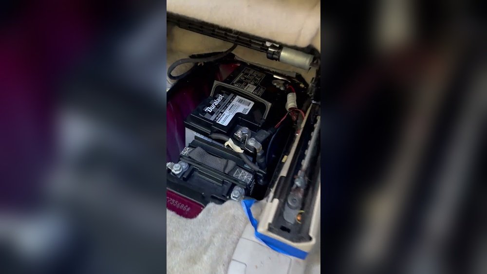 where is the battery on a 2017 jeep grand cherokee